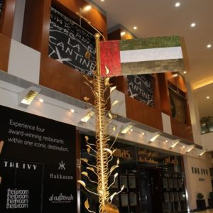 The towering pole represents the monumental achievements of the U.A.E. from it's roots in the past off into the future.