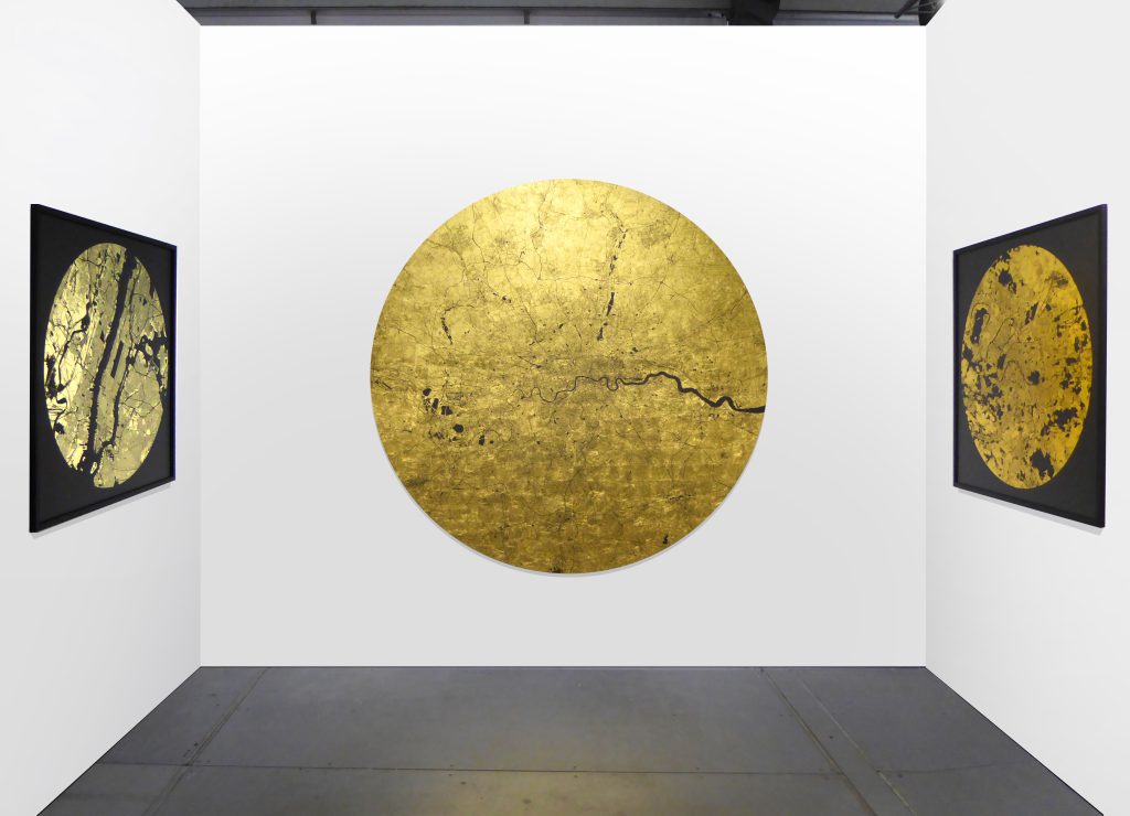 A map made from gold leaf, with details of the streets and rivers picked out in black.