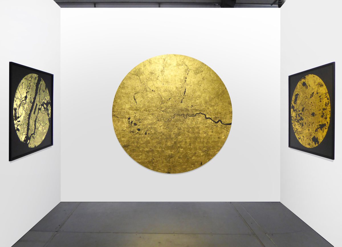 A map made from gold leaf, with details of the streets and rivers picked out in black.