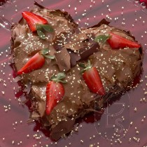 Edible Gold Hearts Sprinkled on Heart-Shaped Cake